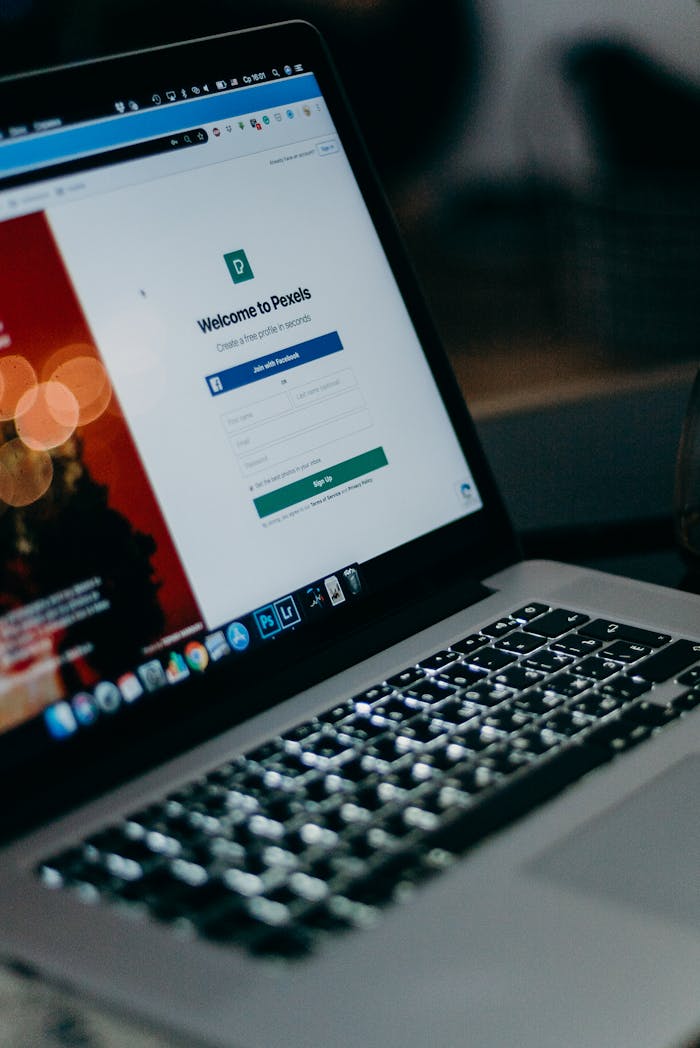 About Close-up of a laptop showing the Pexels login interface with a blurred background, creating a moody tech scene.